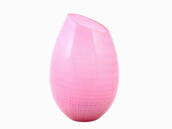 An asymmetrical glass vase in pink and lattimo decor