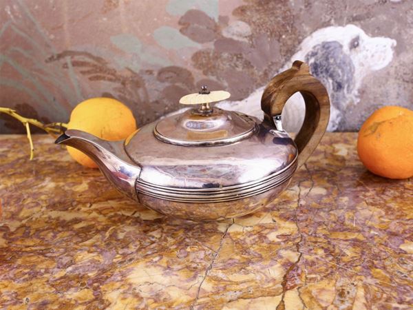 A silver tea pot