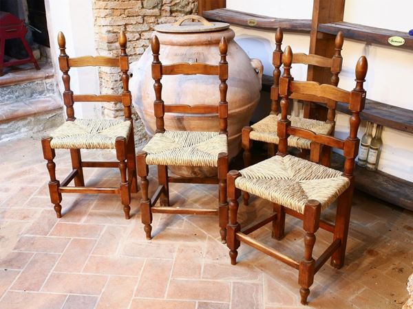 Six rustic walnut chairs