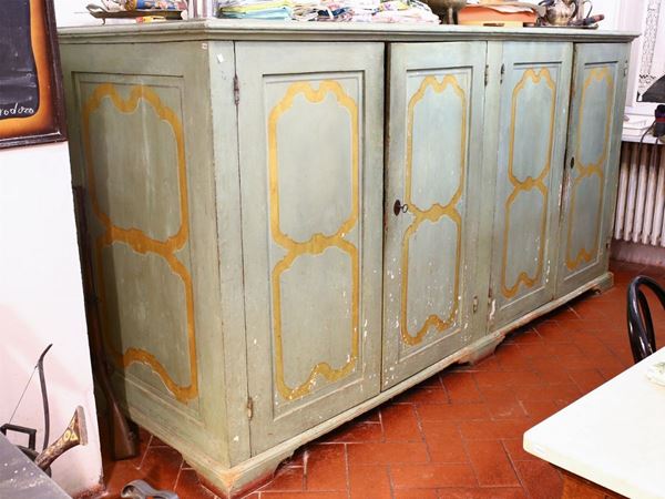 A large green lacqurede sideboard
