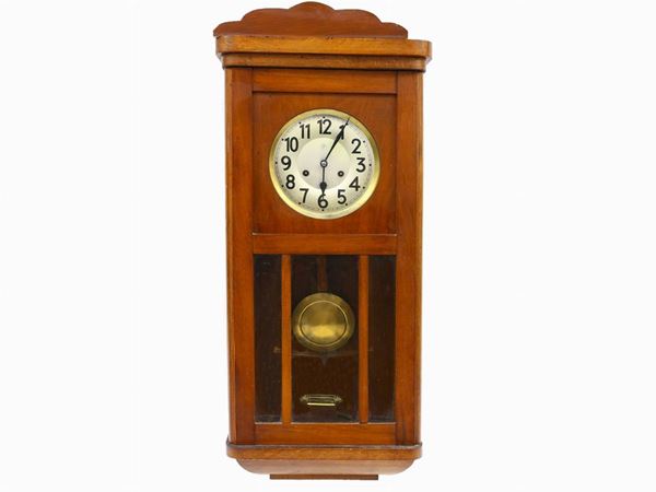 A satinwood pendulum clock