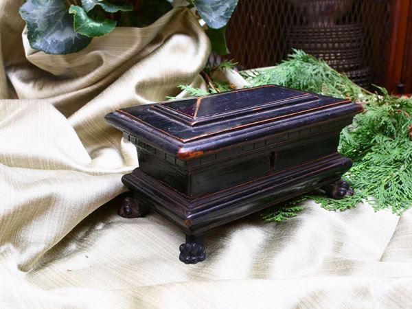 A small ebonized wooden casket