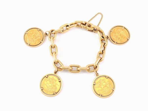 Bracciale in oro giallo con quattro monete pendenti