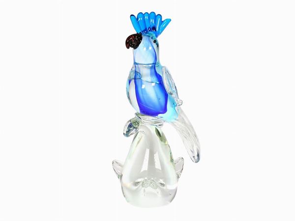 A blue and white glass parrot
