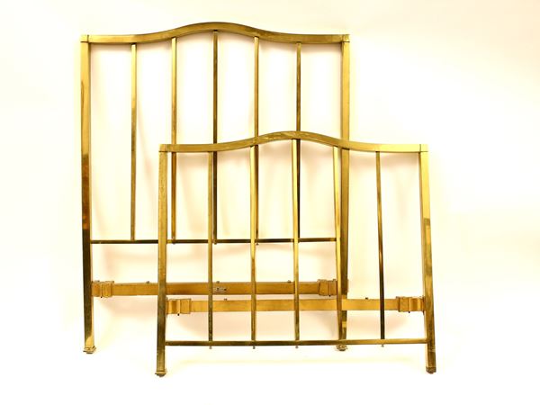 Two single brass beds