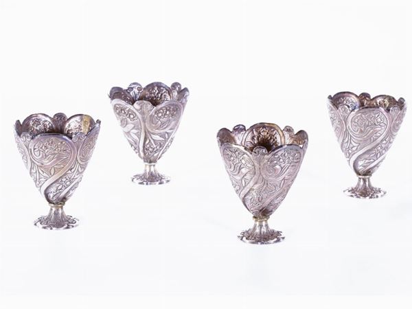 A set of four silver soft-boiled egg cups