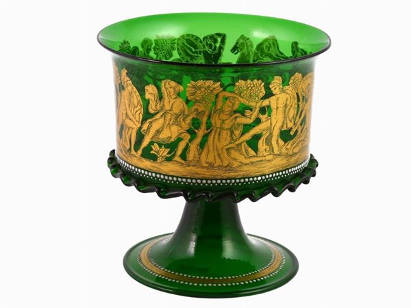 A green blown glass cup