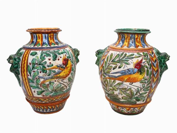 A pair of glazed terracotta vases