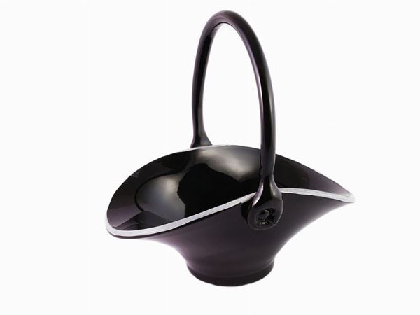 A small glass black basket