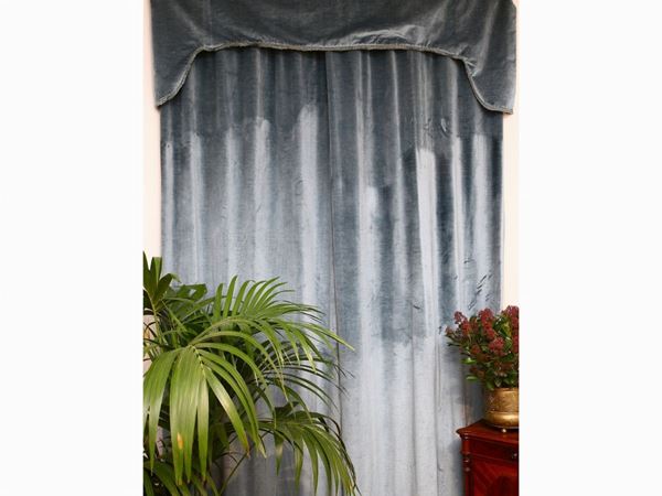 A pair of blue velvet curtains