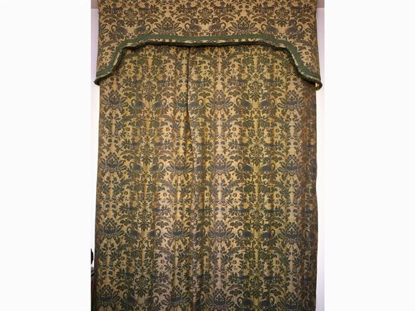 A pair of damask fabric curtains