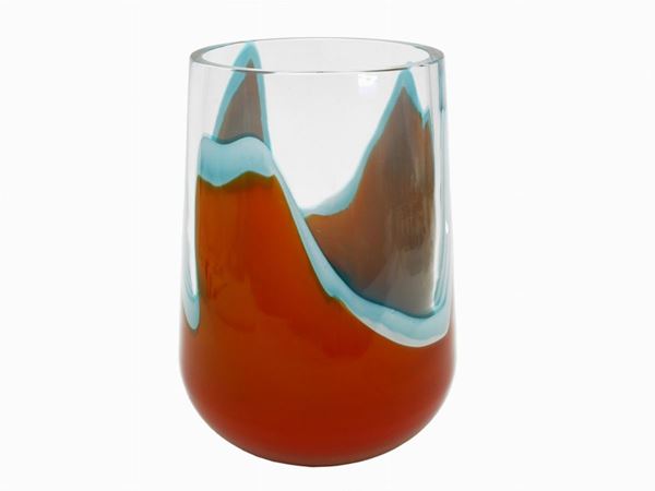 A Seguso thick glass vase with irregular orange and milky-blue decoration. Signed