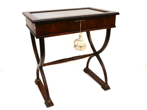 A ebonized wooden collection table