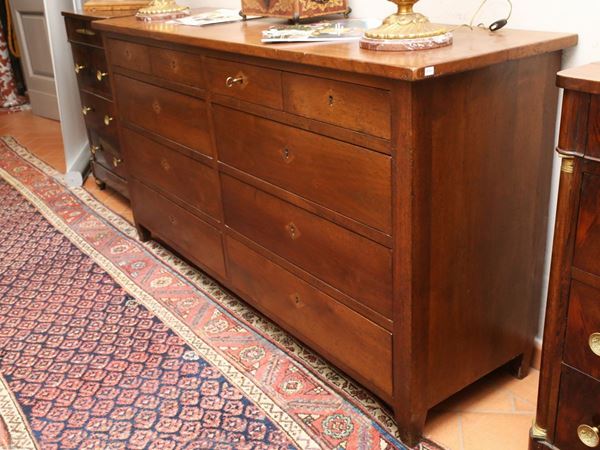 A double walnut chest of drawer
