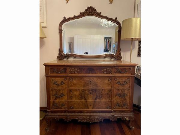 A walnut chest of drawer with its mirror