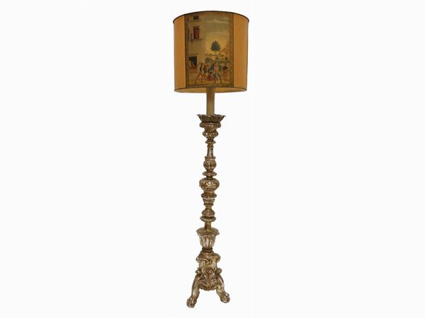 A large giltwood floor lamp