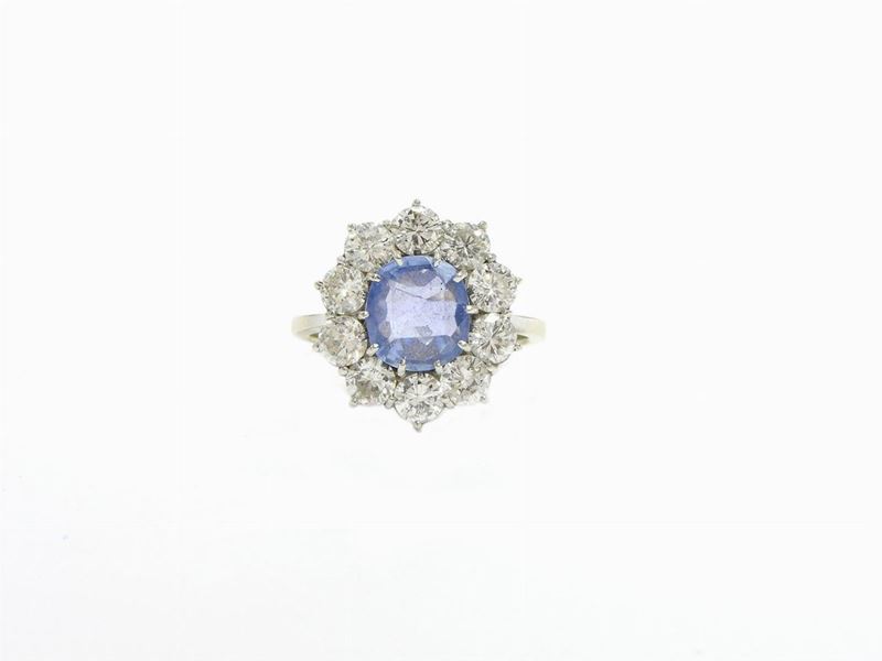 Anello in Oro Bianco con Diamanti e Zaffiro