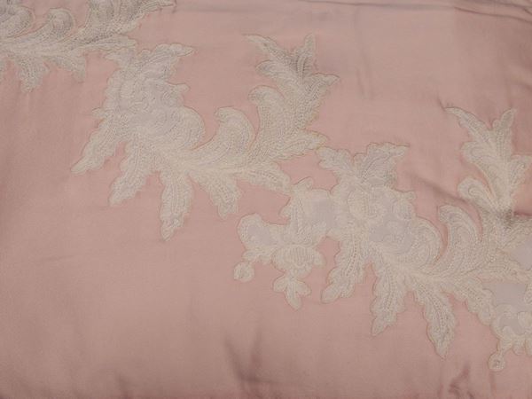 A couple of pink silk pillows