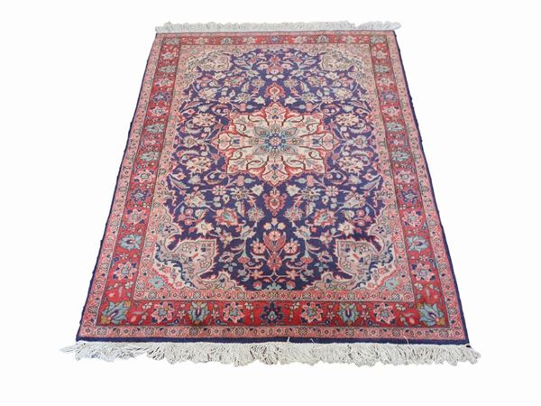 A pair of persian carpets