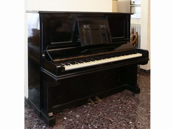 An ebonized uprigth piano Carl Hardt Stuttgard