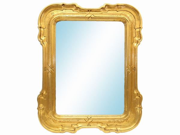 A giltwood and carved frame