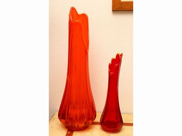 Two orange glass vases