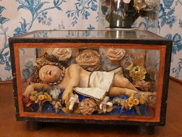 Sleeping Baby Jesus in a glass case