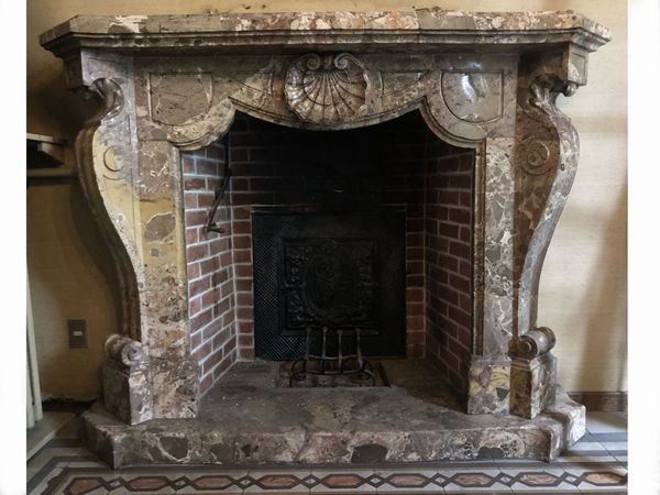 A breccia marble fireplace
