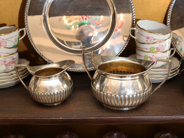A Victorian silver set with sugar bowl and a milk jug