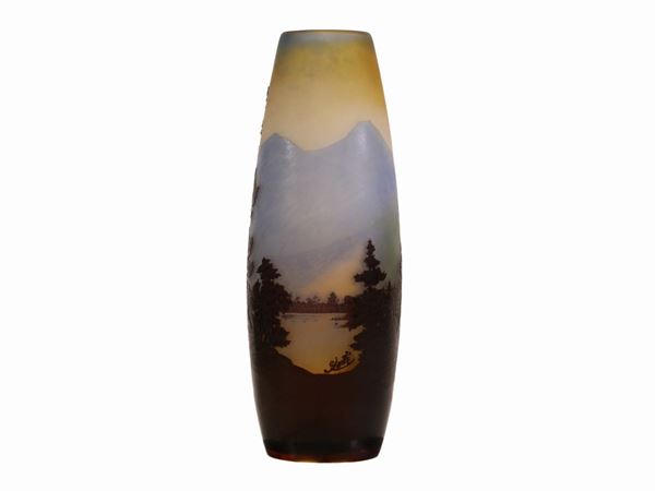 An E.Gallé acid etched cameo glass vase with a Vosgi mountain landscape