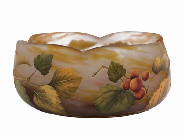 A Daum multi-layered glass quadrilobate cup decorated with rowan trees