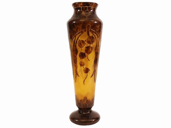 A Le Verre Français glass vase with acid-etched motif of stylized eucalyptus leaves and fruits.
