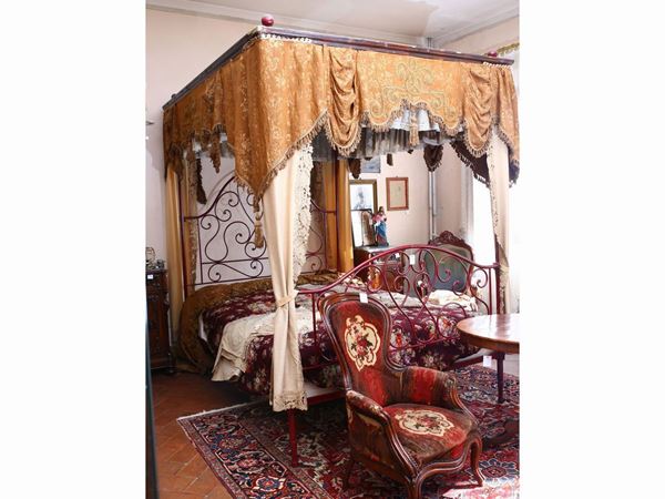 Monumental canopy bed in red wrought iron