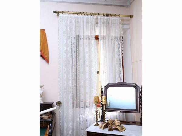 Two mechanical lace curtains