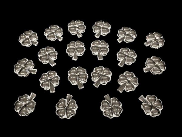 A set of twenty four-leaf clover crystal placeholders