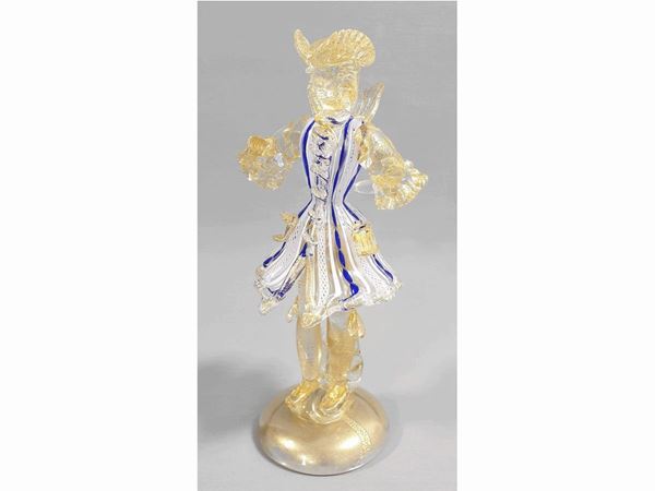 A glass Goldonian figure with gold leaf and blue and lattimo filigree