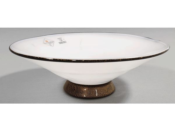 A lattimo centerpiece black and golden leaf base and rim applied. Signed Barovier and Toso