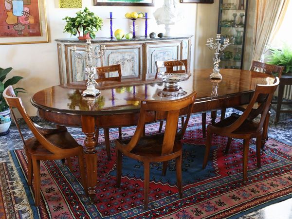 A mahogany and other woods inlaid dining table