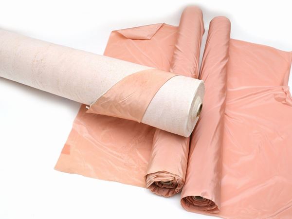 Three pink silk rolls