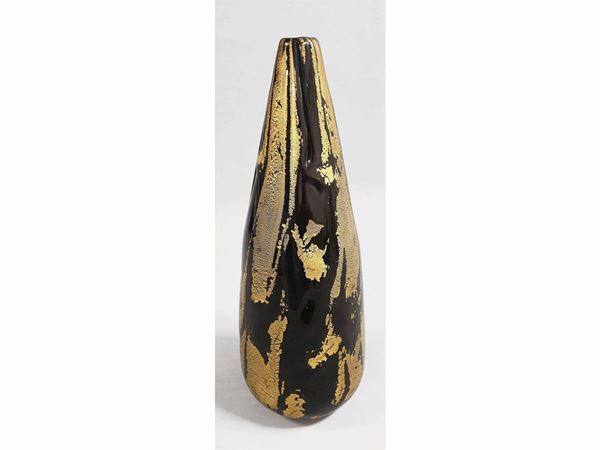 A black glass vase with golden leaf. Signed P.Signoretto.
