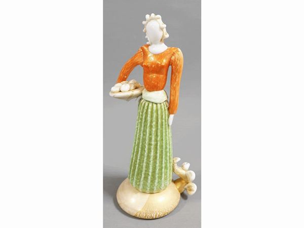 Figure of a paesant woman in multicoloured glass paste and golden leaf