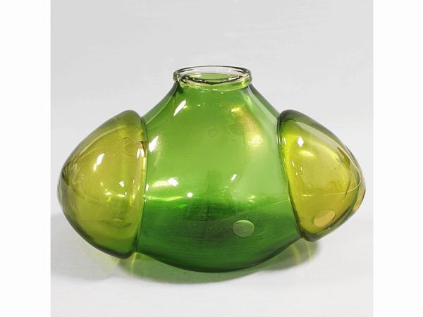 A green glass vase with heavy amber glass application