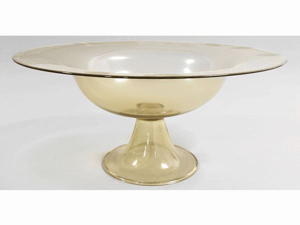 An olive blown glass stand with a base applied. M.V.M.  (Murano, 1930)  - Auction The florentine house of a milanese collector: important glasses, objects of art and contemporary art - Maison Bibelot - Casa d'Aste Firenze - Milano