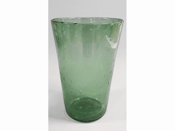 A trasparent green glass vase with bubbles regular.
