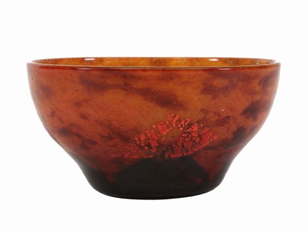 A Daum small multi-layered glass bowl with silver leaf inclusions.
