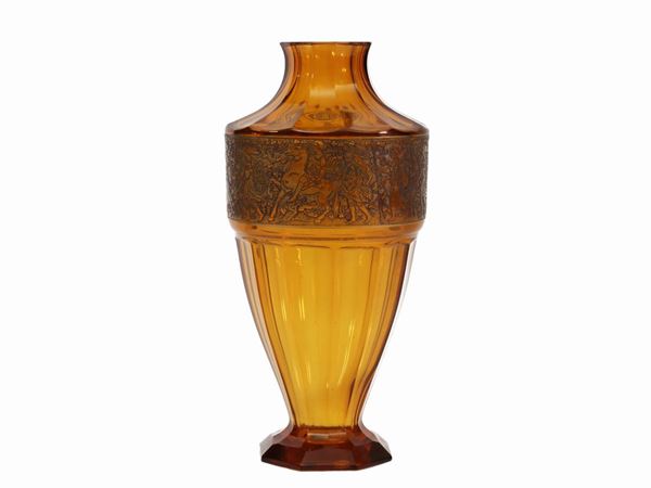 A Moser glass vase in yellow ocher with a classic style band engraved in gold. Signed