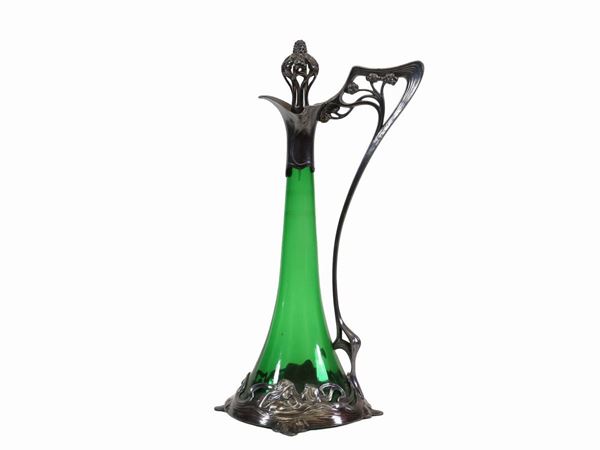 An Orivit green glass pourer with plated metal frame. Orivit