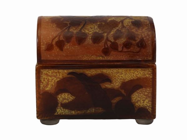 A Gallé double brown cameo glass casket on a light background with floral decoratin. Signed Gallé