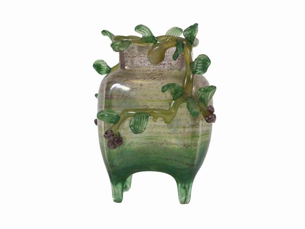A glass vase with four-lobed mouth and hot applications of leaf  shoots