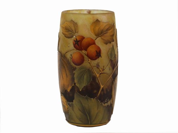 A Daum cameo glass vase with leaves and berries decoration in polychrome enamels. Signed